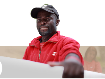 Mover dressed in red carrying a box